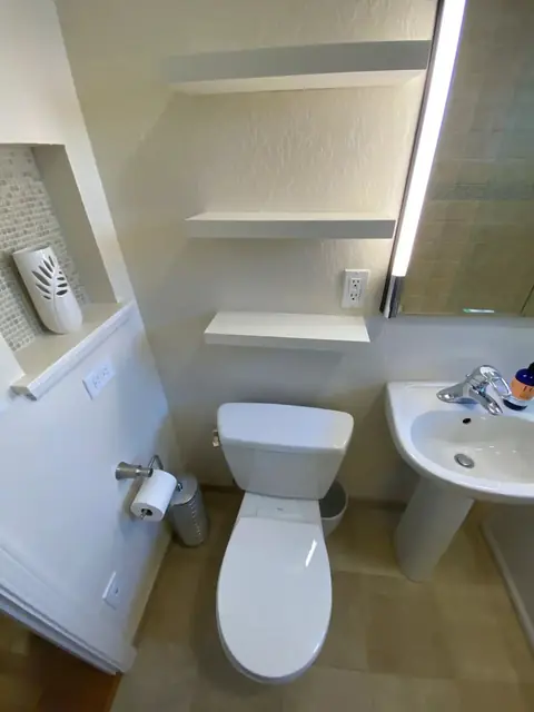 Bathroom with built-in wall niche shelves